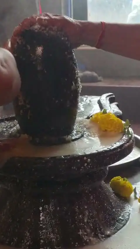 Abhishek on the Shivling